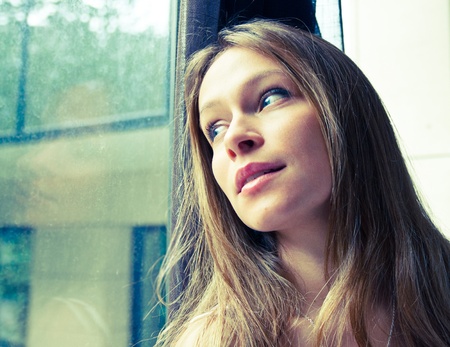 Portrait of a thinking woman looking up