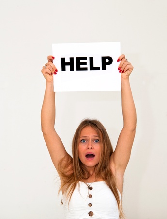 NEED HELP? portrait young woman with board HELPの写真素材