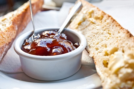Breakfast - breads with fruit jam on tableの写真素材