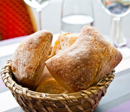 bread in basket - little roll breads in basket on table