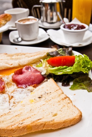 Breakfast with coffee and fresh Toast on tableの写真素材