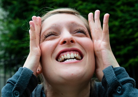 Young woman screaming with crazy expressionの写真素材