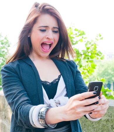 Young woman screaming with crazy expressionの写真素材