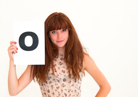 happy portrait young woman with board yesの写真素材