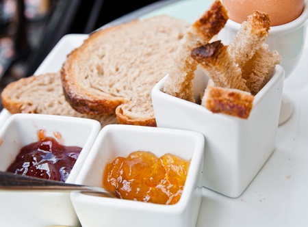 Breakfast with fresh fruit jam on tableの写真素材