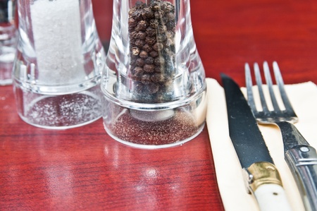 place setting - plate, knife and fork on table