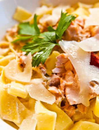 tasty pasta with salmon on a the tableの写真素材