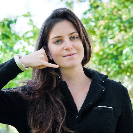 Outdoor portrait young woman talk on a cellular telephoneの写真素材