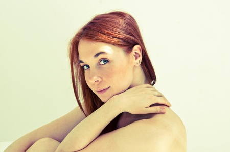 beautiful young woman on the couch in the living roomの写真素材