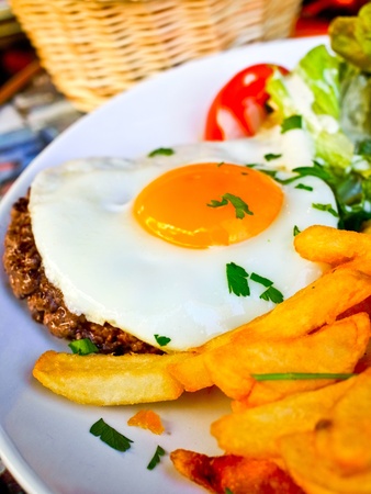 Egg and fries - classical english breakfast with egg and friesの写真素材