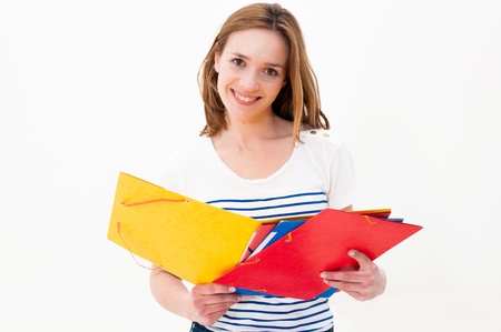 Beautiful woman with a folder on a white backgroundの写真素材