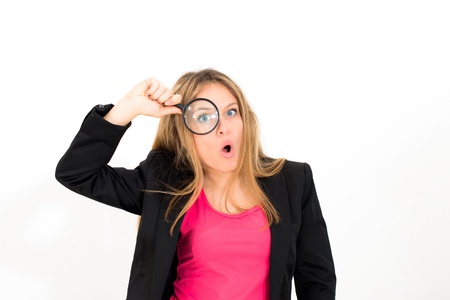 woman with magnifying glass on a white backgroundの写真素材