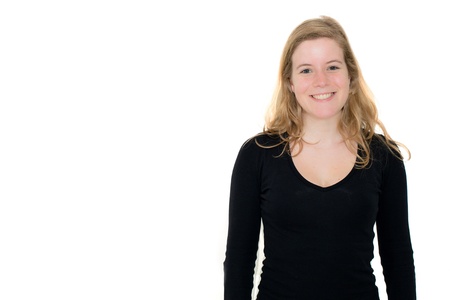 Portrait of a happy young woman smiling against white backgroundの写真素材