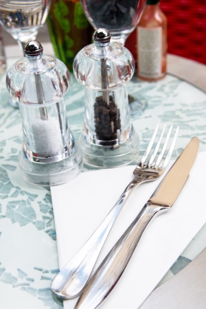 place setting - plate, knife and fork on tableの写真素材