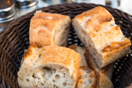 bread in basket - little roll breads in basket on table