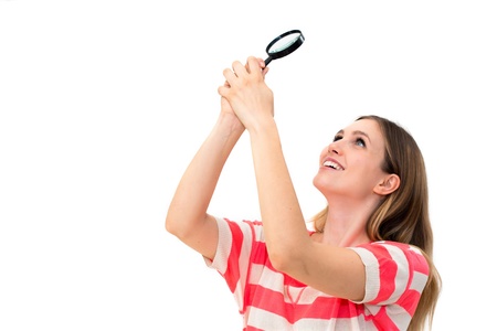 woman with magnifying glass on a white background