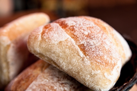bread in basket - little roll breads in basket on table