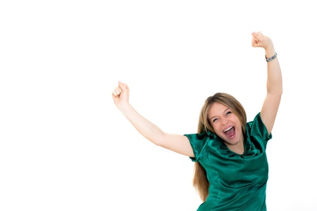 excited young woman celebrating success on white backgroundの写真素材
