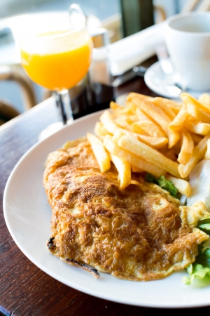 omelet with ham tomato and green saladの写真素材