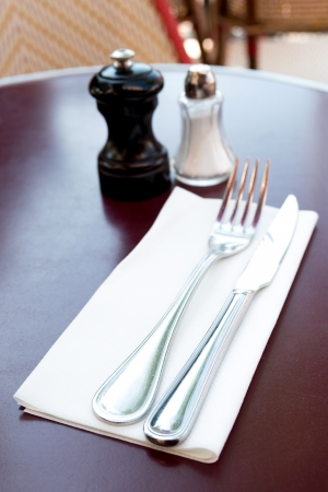 place setting - plate, knife and fork on tableの写真素材