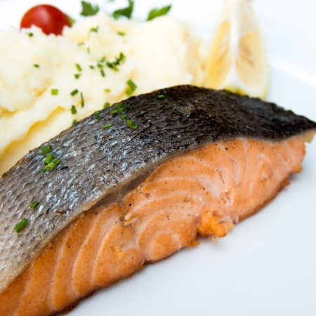 grilled salmon and lemon - french cuisine dish with salmonの写真素材
