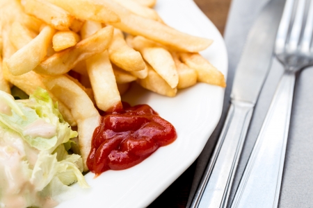 Golden French fries potatoes ready to be eatenの写真素材