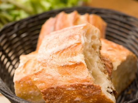 bread in basket - little roll breads in basket on table