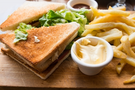 Sandwich with bacon - chicken, cheese and lettuceの写真素材
