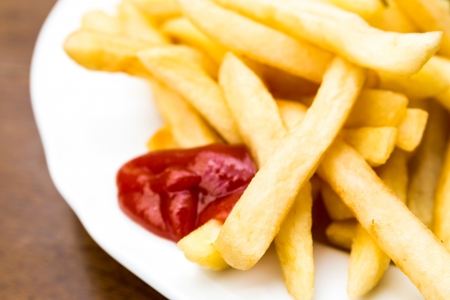 Golden French fries potatoes ready to be eatenの写真素材