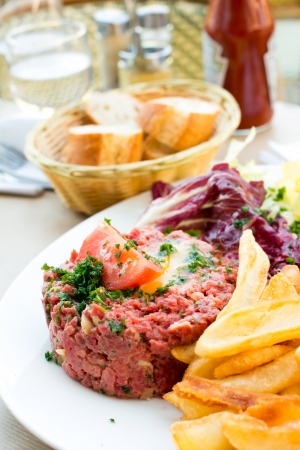 tasty tartare(Raw beef) - classic steak tartare on white plateの写真素材