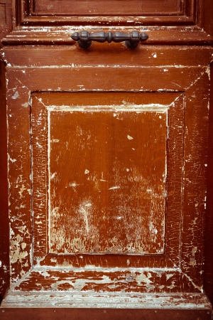 Old wooden door with metal handleの写真素材