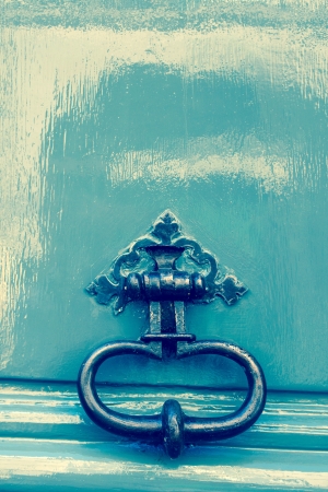 Old wooden door with metal handleの写真素材
