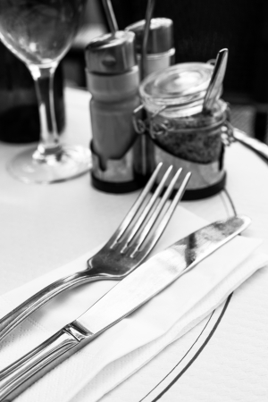 table setting - plate, knife and fork on table