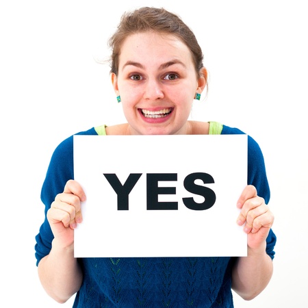 happy portrait young woman with board yes の写真素材