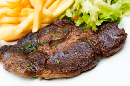 juicy steak beef meat with french friesの写真素材