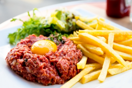 tasty tartare Raw beef  - classic steak tartare on white plateの写真素材
