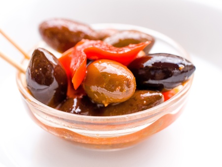 delicious olives in bowl on tableの写真素材