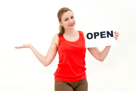 happy portrait young woman with board OPENの写真素材