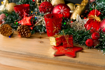 Christmas decoration with presents over wooden backgroundの写真素材
