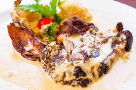 juicy steak beef meat with tomato and potatoesの写真素材
