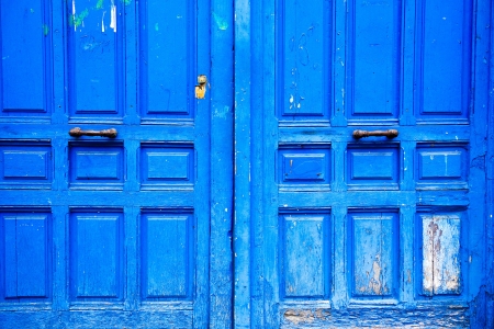 Old wooden door with metal handleの写真素材
