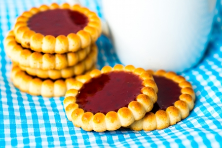 Strawberry biscuit with a drink in the backgroundの写真素材