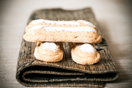 sponge fingers sugar biscuit on brown napkinの写真素材