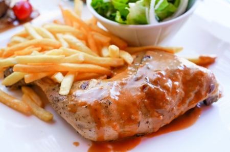 delicious chicken on white plateの写真素材