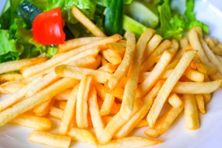 Golden French fries potatoes ready to be eatenの写真素材