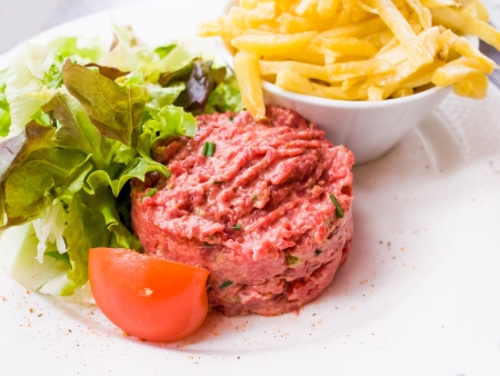 tasty Steak tartare (Raw beef) - classic steak tartare on white plateの写真素材
