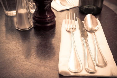 table setting - plate, knife and fork on tableの写真素材