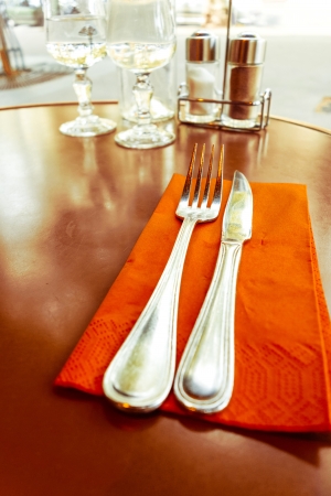 table setting - plate, knife and fork on tableの写真素材