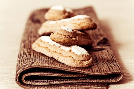 sponge fingers sugar biscuit on brown napkinの写真素材