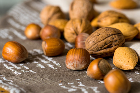 Vintage styled Mixed nuts on brown napkin の写真素材